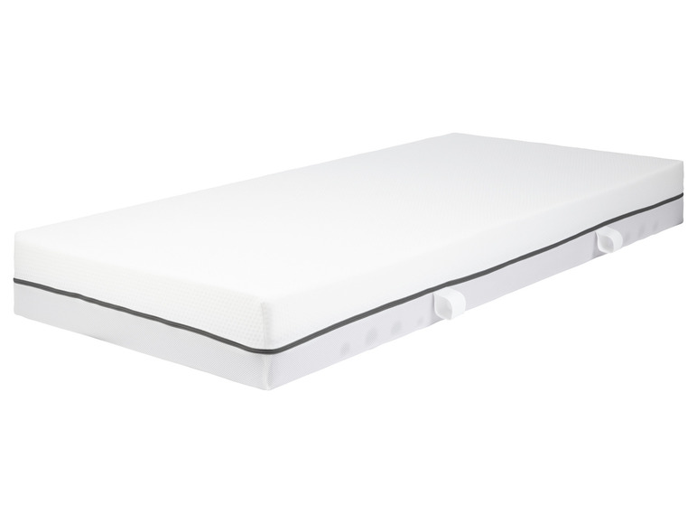 Een wit matras met een grijze rand.
