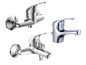 Drie chromen kranen voor badkamer of keuken.