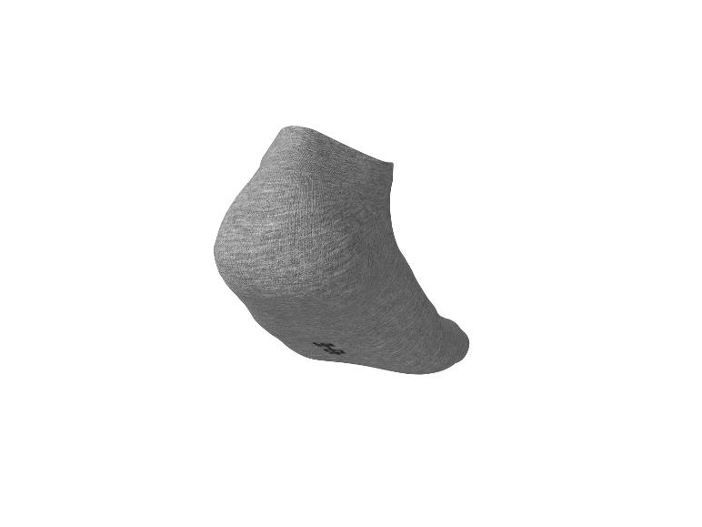 Chaussette courte grise avec un petit logo sur la semelle.