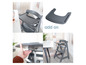 Une chaise haute grise avec un plateau amovible, idéale pour les repas des enfants.