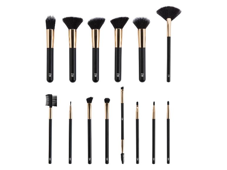 Un ensemble de 15 pinceaux de maquillage noirs et dorés, incluant divers pinceaux pour le visage et les yeux.