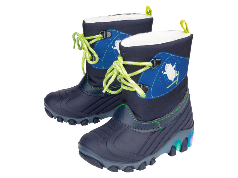 Deux paires de bottes d'hiver bleues avec des lacets verts.