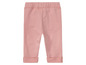 Roze baby leggings met gevouwen zoom.