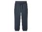 Pantalon de survêtement bleu foncé avec cordon de serrage et poignets côtelés.