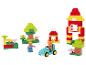 Blocs de construction avec une maison, une voiture, des arbres et des figurines.