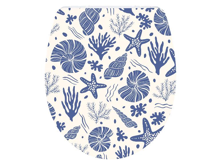 Abattant de toilettes avec motif de coquillages, étoiles de mer et coraux.