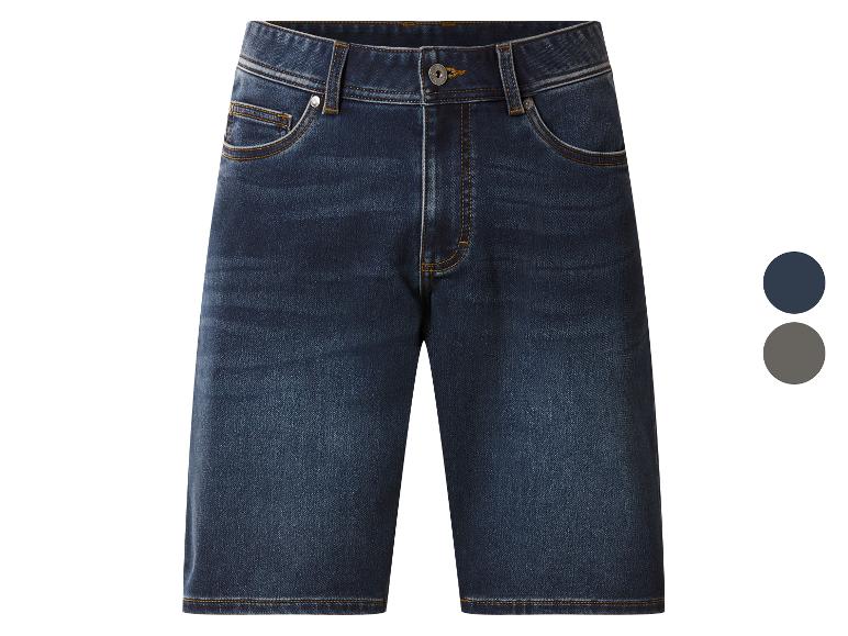 Donkerblauwe denim shorts met oranje stiksels en metalen knopen.
