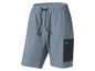Blauwe sportbroek met zwarte details en een zak.