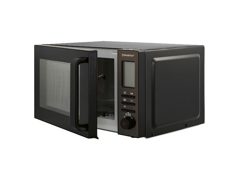 Zwarte magnetron met open deur, digitaal display en bedieningsknop.