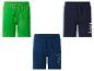 Drie kinderbroekjes: groen met palmboommotief, donkerblauw met Super Mario en donkerblauw met Minecraft.