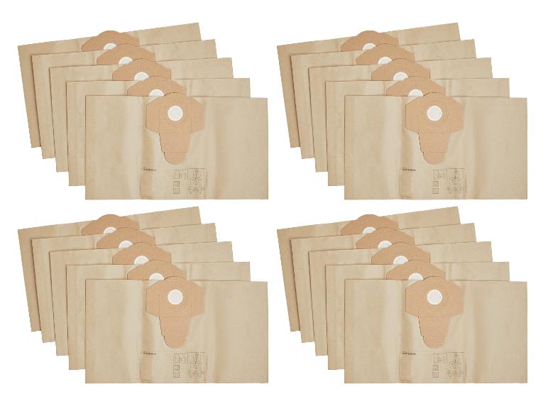 Quatre piles de sacs d'aspirateur en papier kraft, avec des instructions d'utilisation visibles.