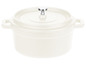 Witte gietijzeren braadpan met deksel.