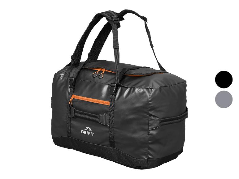 Sac de voyage CRIVIT noir avec détails orange.
