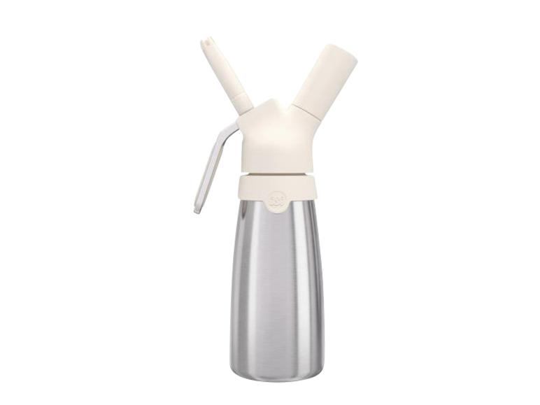 Siphon à crème en acier inoxydable avec un dessus et un levier beige clair.
