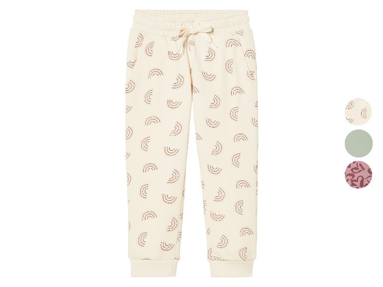 Pantalon de jogging blanc à motif arc-en-ciel.
