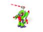 Jouet robot vert et rouge avec un projectile rouge sortant d'un canon.