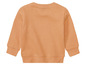 Un sweat-shirt à manches longues orange pour enfants.