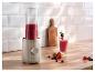 SilverCrest blender met rode smoothie, fruit en een glas op een houten aanrecht.