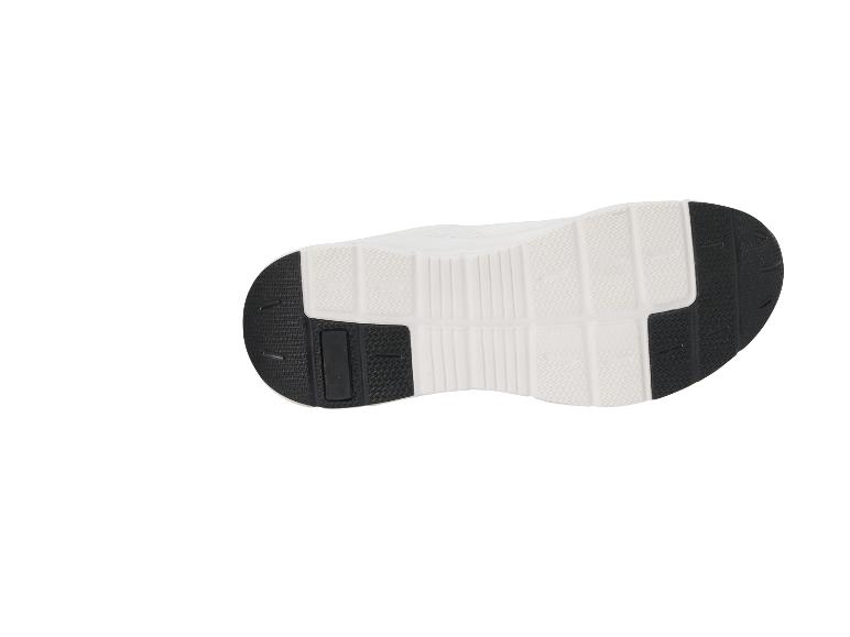 Semelle de chaussure de sport blanche et noire avec motif d'adhérence.