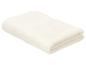 Serviette de bain pliée de couleur crème