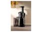 Een SilverCrest sapcentrifuge met sapreservoir.