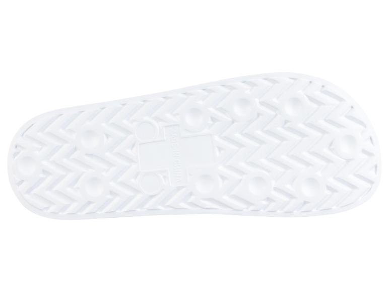 Semelle de chaussure blanche avec motif en zigzag.