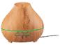 Diffuseur d'huiles essentielles aspect bois avec bande lumineuse verte et boutons de commande