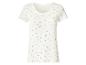 T-shirt femme blanc à motif floral et bords ondulés.