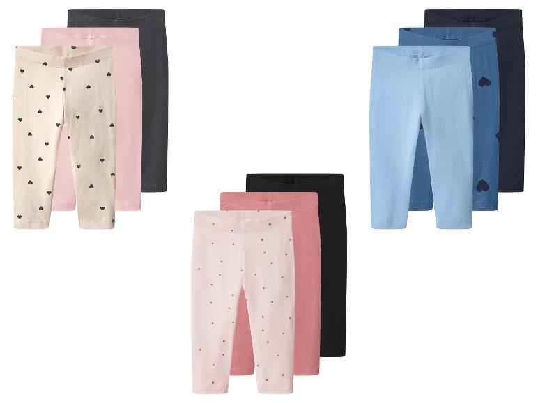 Set van 9 kinderleggings in diverse kleuren en patronen.