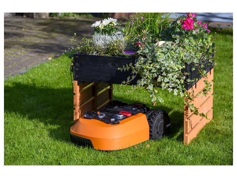 Robotmaaier en bloempot: eenvoudig tuinonderhoud.