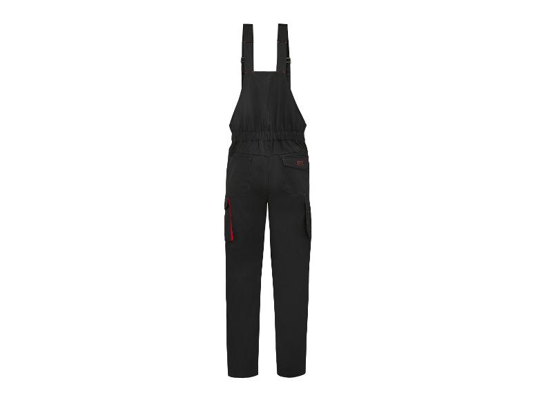 Zwarte werkbroek met bretels en rode details, achteraanzicht.