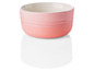 Een roze Le Creuset ovenschaal.