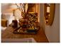 LIVARNO home led-windlicht met bladerenpatroon op een houten tafel.