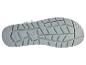La semelle d'une chaussure grise avec un motif en relief.