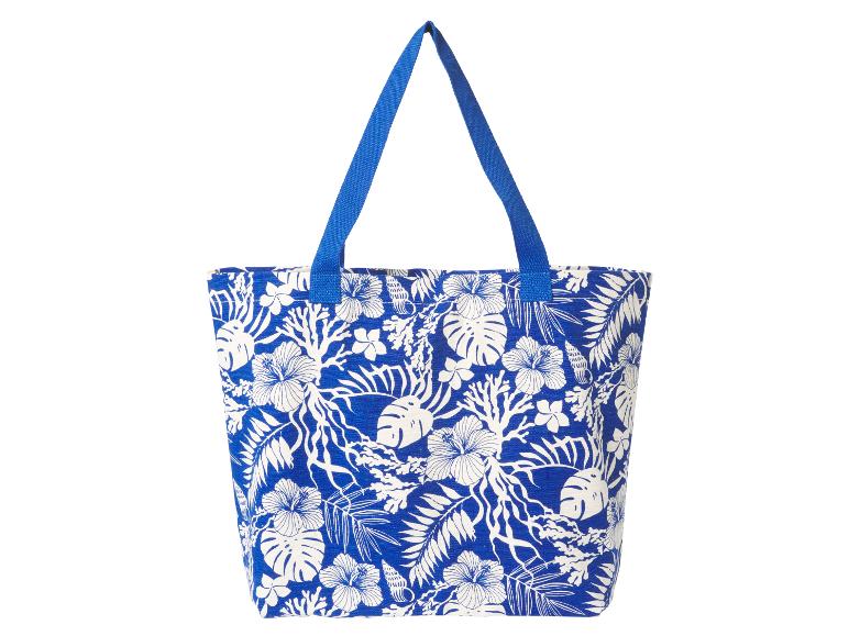 Blauwe tote bag met tropische bloemenprint.