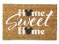 Paillasson marron avec l'inscription 'Home Sweet Home' et des têtes de souris noires.
