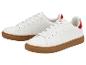 Witte sneakers met rode accenten en bruine zolen