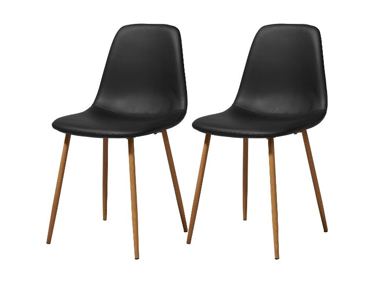 Deux chaises de salle à manger noires avec pieds en bois clair
