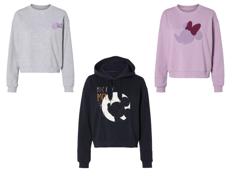 Drie Disney-sweaters: Mickey Mouse, Donald Duck en Minnie Mouse.