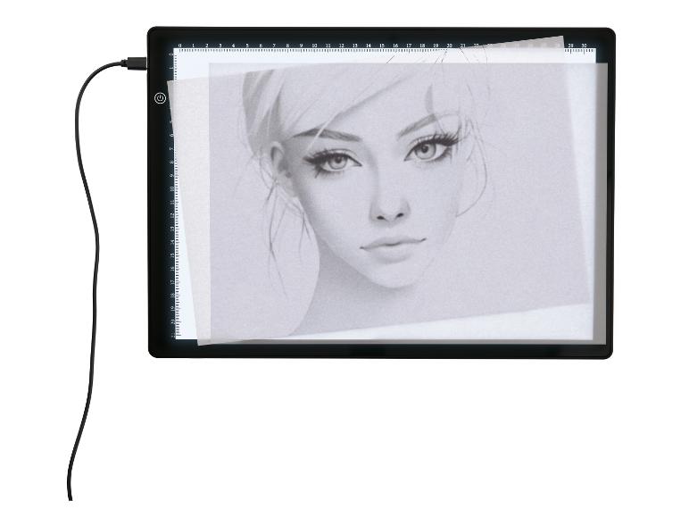 Tablette lumineuse LED avec dessin de portrait féminin et câble USB.