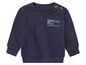 Un sweat-shirt bleu marine pour bébé avec l'inscription 'future'.