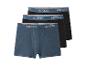 Trois boxers pour hommes, un bleu et deux noirs, avec la marque esmara sur la ceinture.