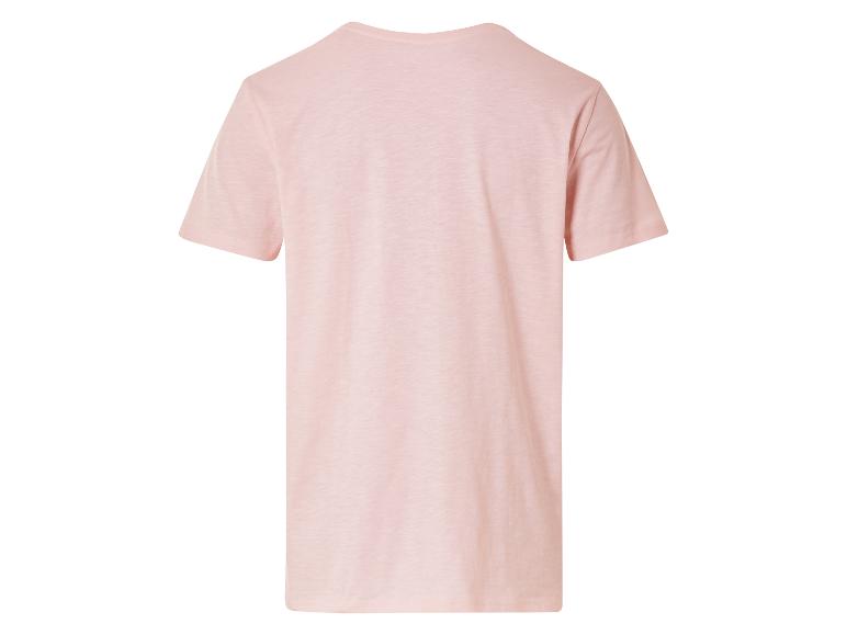 T-shirt rose clair à manches courtes.