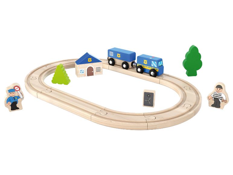 Train en bois avec un wagon de police bleu et des accessoires.