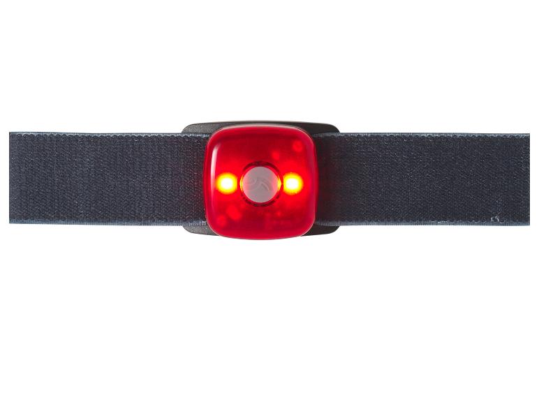 Rood LED-veiligheidslicht met zwarte band, verlicht.