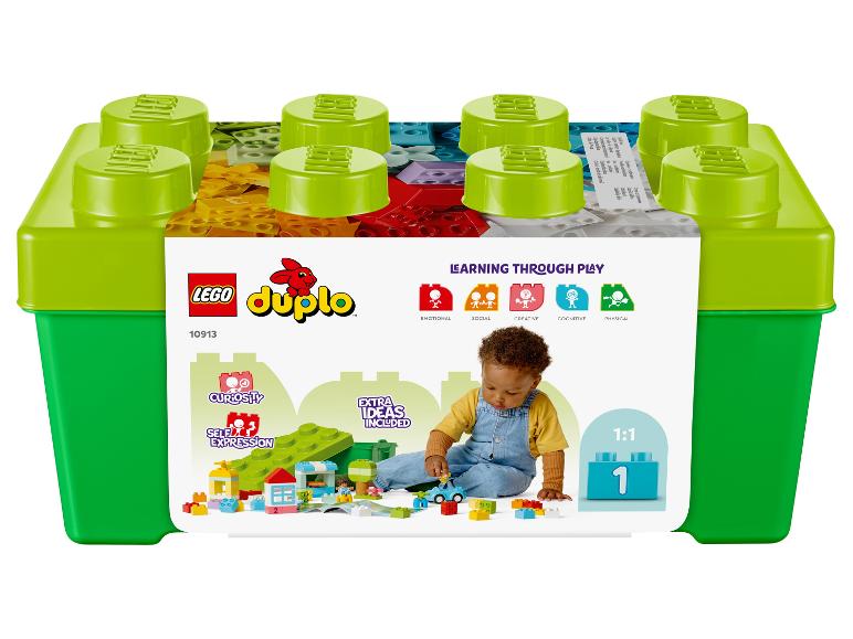 Boîte de rangement LEGO Duplo avec des briques colorées et un enfant qui joue.