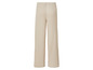Pantalon beige à jambes larges.