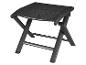 Tabouret pliant noir avec cadre métallique et assise en textile.