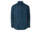 Une chemise à manches longues bleu foncé avec un motif géométrique.