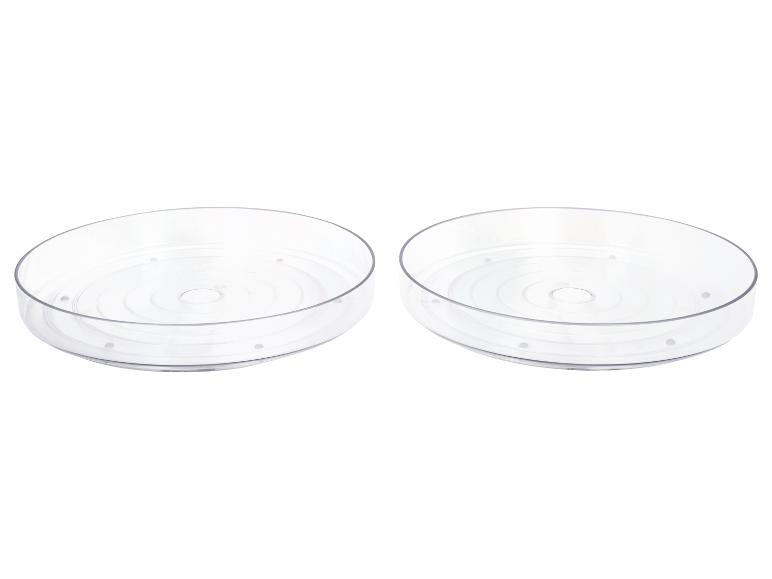 Deux plateaux de rangement ronds transparents.